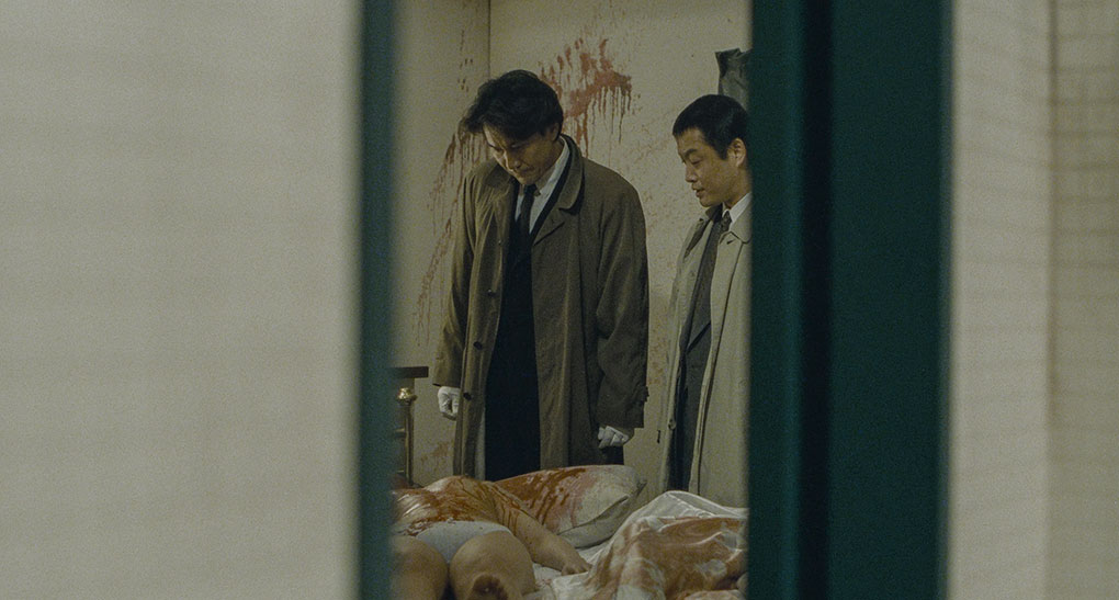 Takabe examines the body of the latest victim