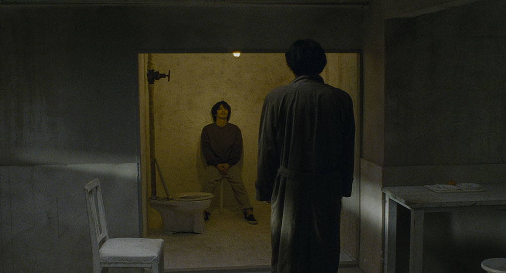 Takabe confronts Mamiya in his holding cell