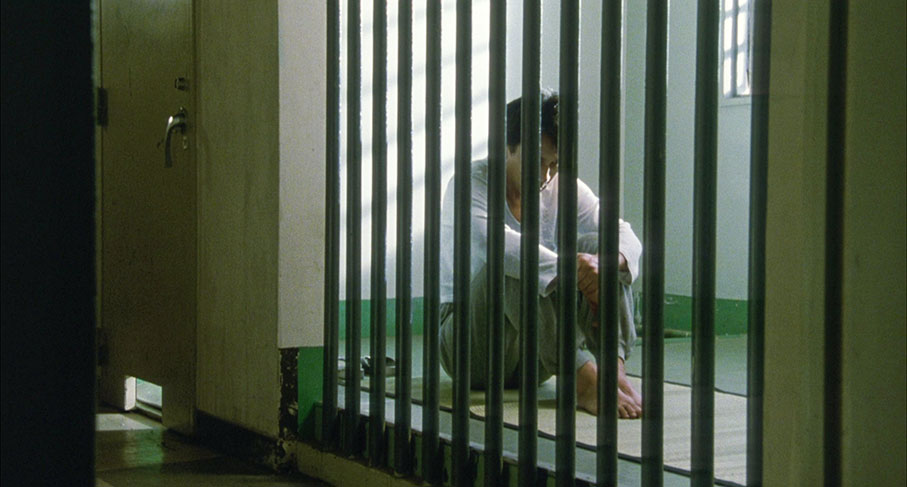Takuro in his cell in the director's cut of the film