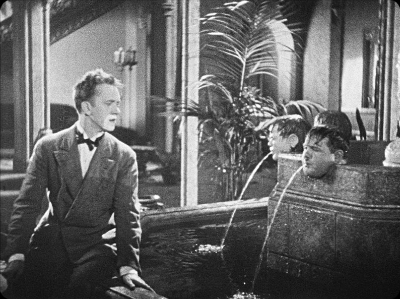 Ollie hides amongst the fountain heads in Early to Bed