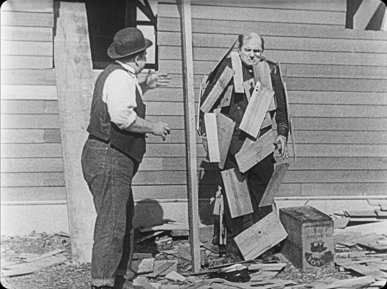 Edgar Kennedy's cop gets hit with glue and roof tiles in The Finishing Touch