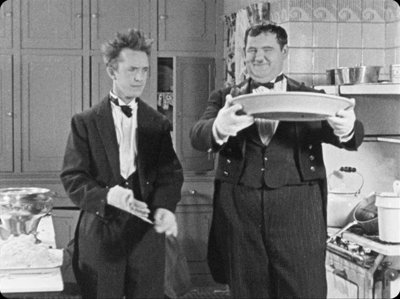 Stan and Ollie prepare to serve in From Sioup to Nuts