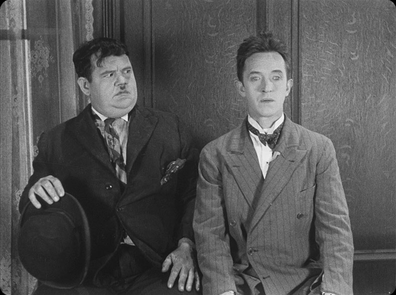 Stan and Ollie are confused by the professor's behaviour in Habeus Corpus