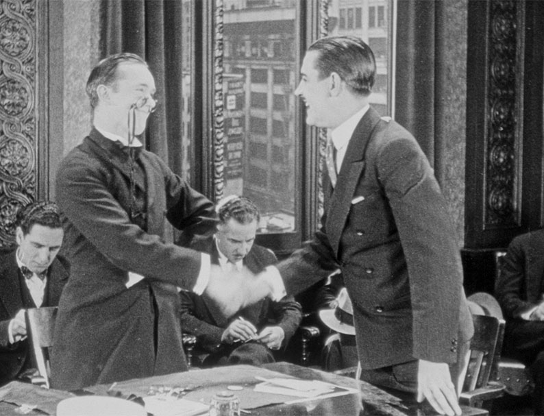 Charley Chase prematurely congratulates his lawyer (Stan) in Now I'll Tell One