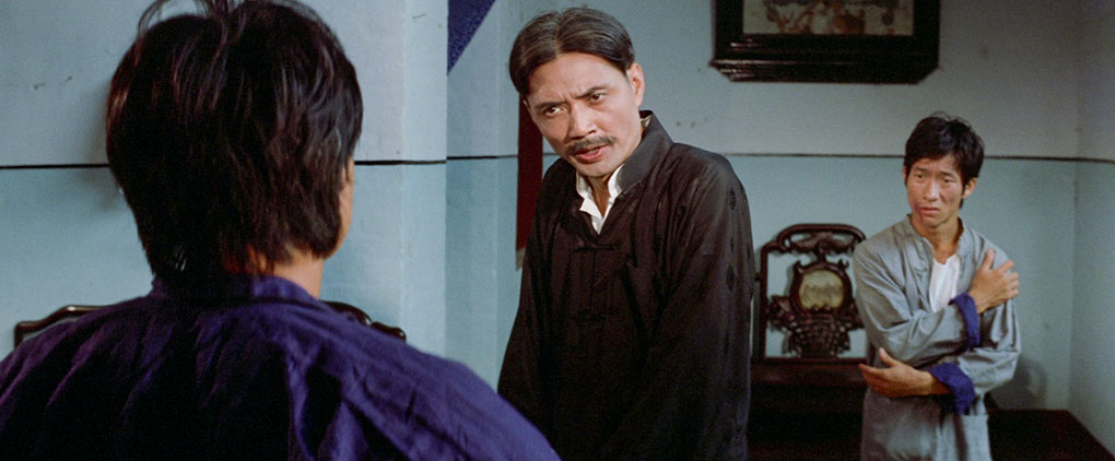 Zhuang confronts the North Gate men as an injured Jun Ping looks on