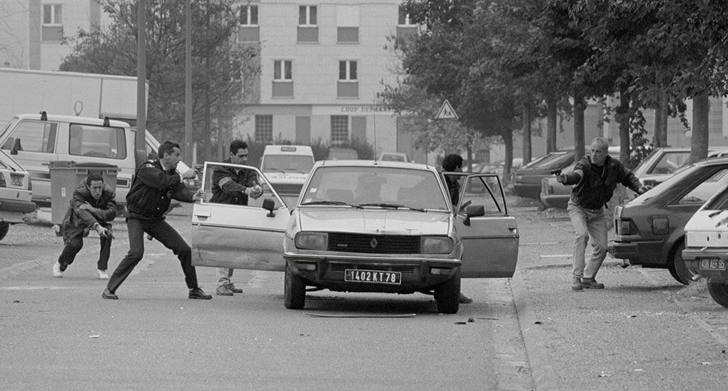 Things kick off with the police when one man opens fire on them