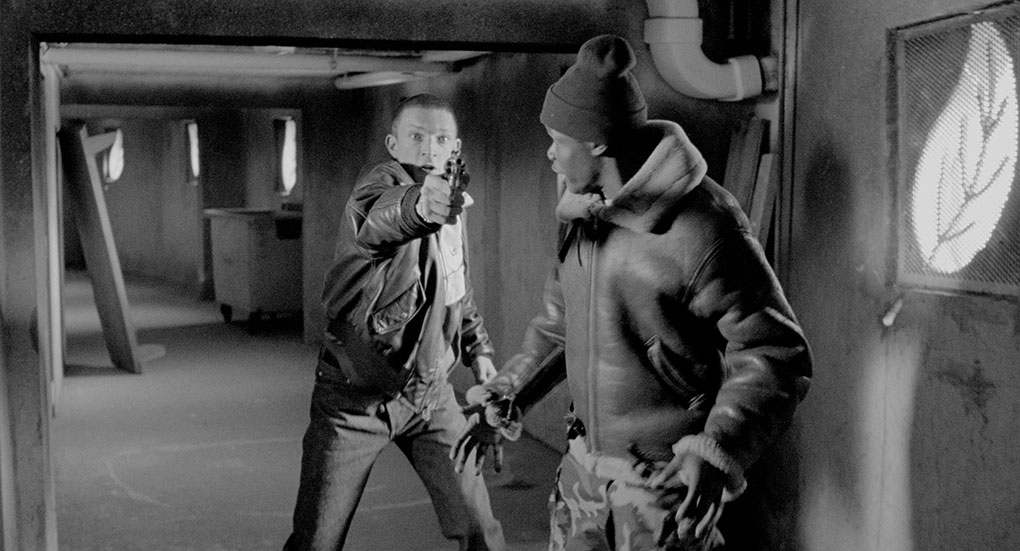 Vince pulls the gun to scare off a cop when fleeing