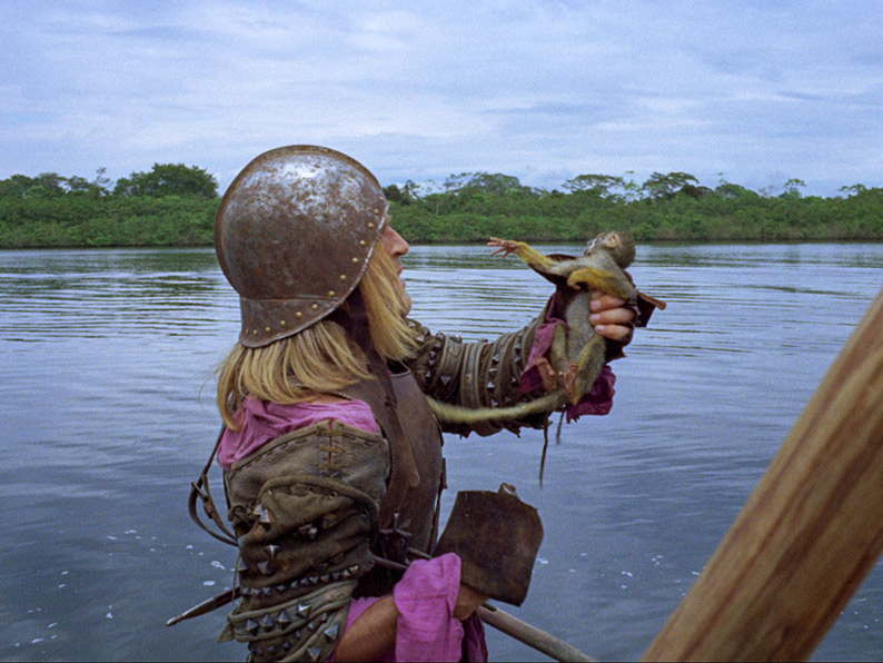 Aguirre on board a raft with monkeys
