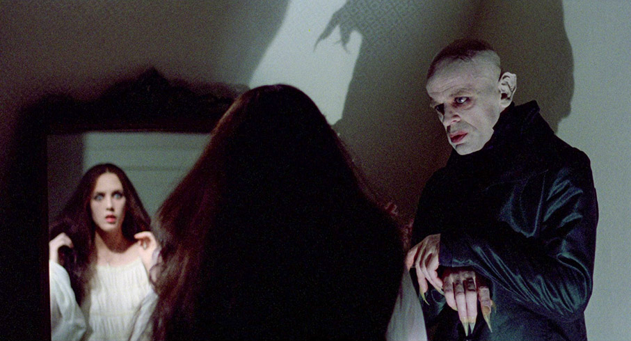 Dracula visits Lucy in her bedroom
