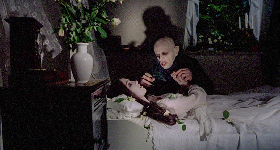 Lucy draws Dracula to her as dawn draws near