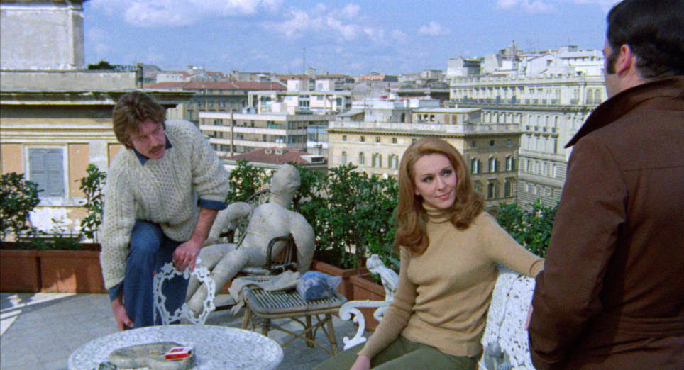 Merughi questions Kitty and Alberto about the case