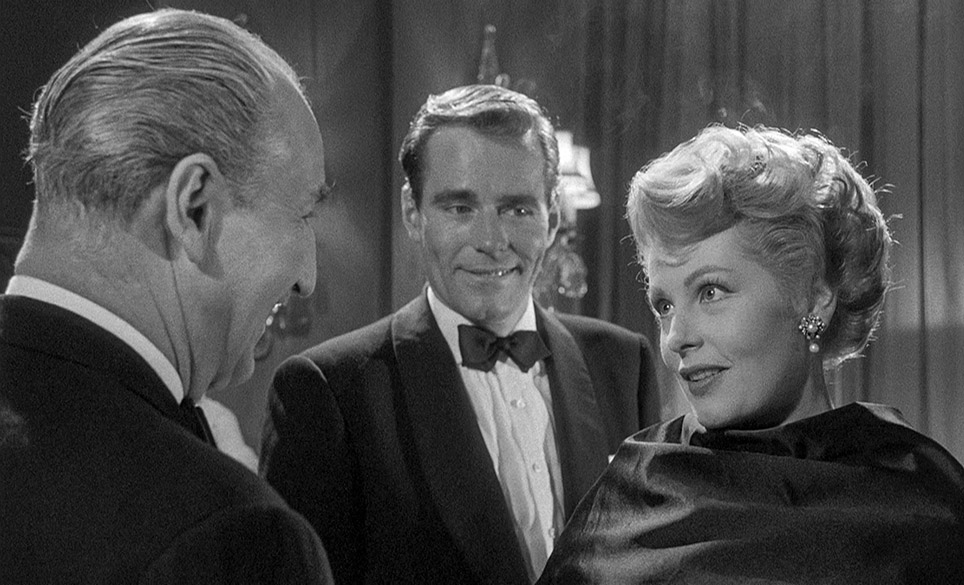 Tim watches on as Kathy flirtts with company boss John Dowling