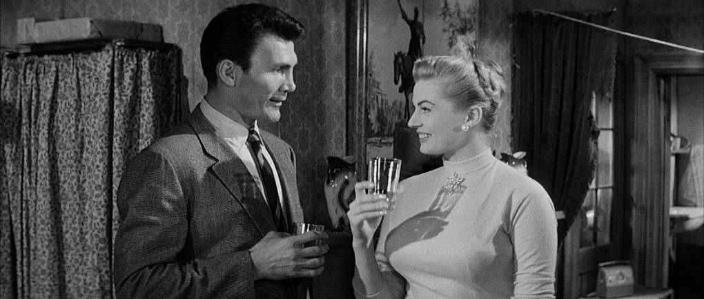 Milo and Trudie share a drink in Carter's former apartment