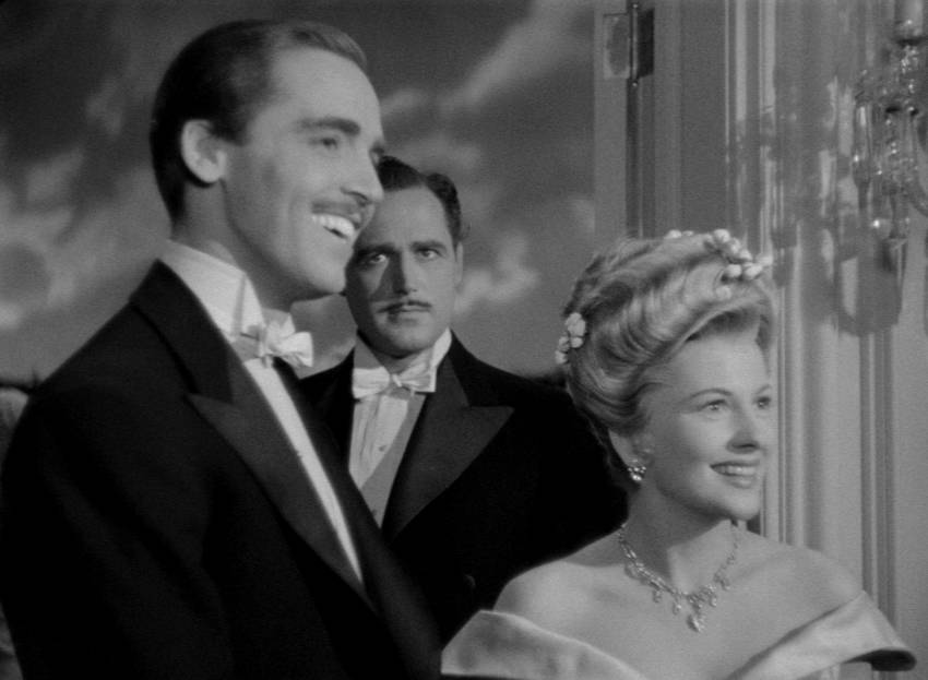 Jervis and Ivy converse jovially with Miles and Bella as a jealous Roger looks on