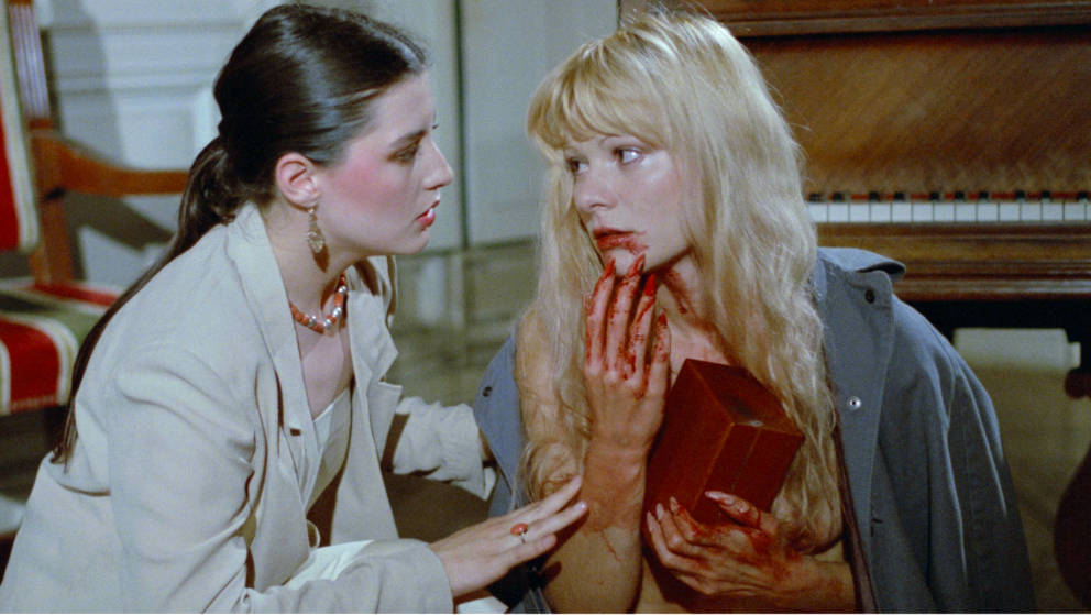 Hélène tries to comfort the post-slaughter Catherine as she holds on to her once precious music box