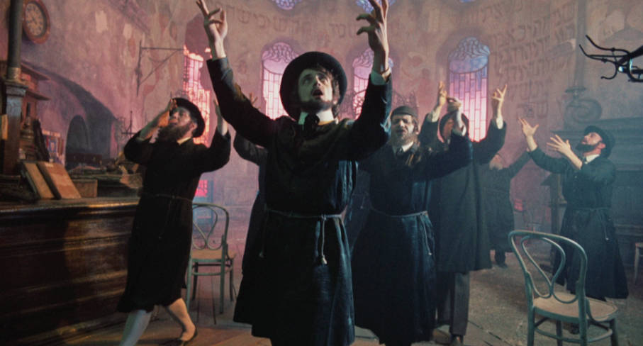 The local Jewish community dances and sings to welcome the day